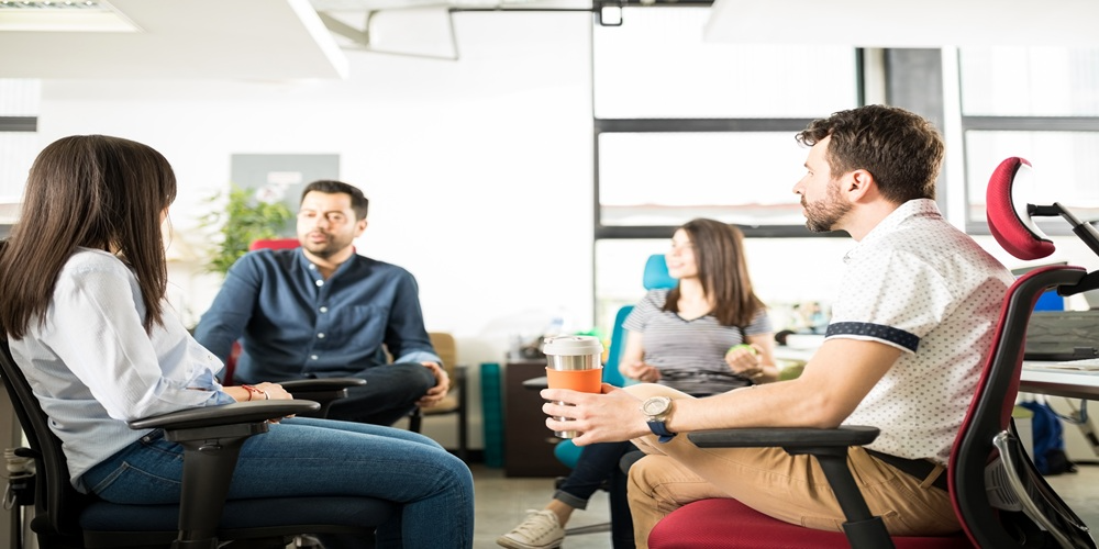 group four businesspeople having meeting startup office